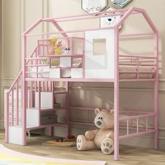 a pink bunk bed with a teddy bear underneath it