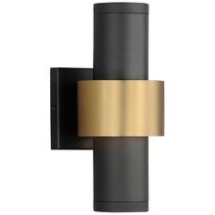 a black and gold wall light on a white background