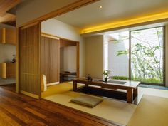 a living room with wood floors and sliding glass doors