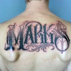 a man with a tattoo on his back that reads mark and has the word mark written in cursive font