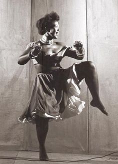 an old photo of a woman dancing