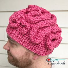 a man wearing a pink knitted hat