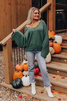 - This cozy sweater has trendy style and a feminine twist! - Unlined knit material - A v-cut neckline with a hooded back and gold and faux pearl accent buttons - A rolled center seam accent - Long, dolman sleeves - An ultra relaxed silhouette that ends in a straight hemline with ribbed detail Green V-neck Sweater For Fall, Oversized Green V-neck Sweater, Trendy Green Fall Sweater, Green Knit V-neck Sweater For Fall, Green Knit V-neck Sweater For Winter, Cozy Green V-neck Sweater, Trendy Soft Knit V-neck Sweater For Fall, Green Knit V-neck Outerwear, Soft Knit Green Sweater