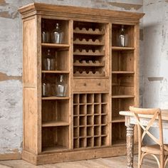 a wooden cabinet with wine bottles on it