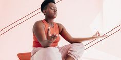 a woman sitting in a lotus position with her hands up to the side and eyes closed