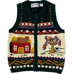 a sweater vest with an image of a house on the front and trees in the back