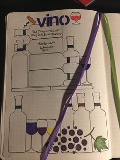 an open notebook with wine bottles on it and a purple pen next to the book