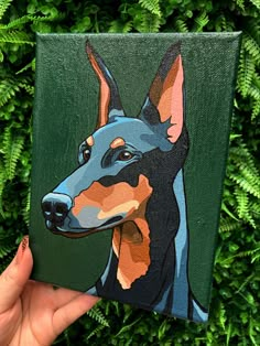 a painting of a doberman dog is shown on a green background with fern leaves