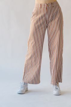 Shine like a star in our Moria Striped Wide Leg Pants! These stylish pants feature trendy bronze and ivory stripes, making them a versatile addition to your wardrobe. The wide leg style provides comfort and a flattering silhouette. Perfect for any occasion, whether you're running errands or hitting the town. Details self/lining: 100% polyester Fabric Care Guide Here Sizing & Fit Measurements are approximate and taken while laying flat across the front. Not doubled. small: bust = "; waist = "; length = " medium: bust = "; waist = "; length = " large: bust = "; waist = "; length = " Try-on Video Piper And Scoot, Shine Like A Star, Winter Maternity, Striped Wide Leg Pants, Velvet Midi Dress, Stylish Pants, Velvet Pants, Wide Leg Pant, Fashion Over 40