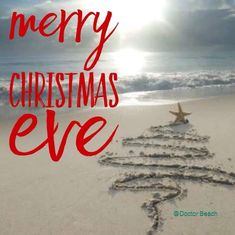 a merry christmas eve message written in the sand