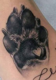 a dog paw with a heart on it and the word love written in cursive writing