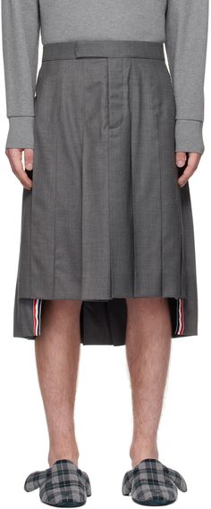 Wool twill skirt. Pleats throughout. · Button-fly · Signature tricolor grosgrain trim at hem · Adjustable buttoned tab at back waistband · Signature tricolor grosgrain flag at back waistband · Full plain woven lining Supplier color: Medium grey Bridal Party Glasses, Guys In Skirts, Casual Shorts For Men, Twill Skirt, Gender Neutral Clothes, Party Glasses, Box Pleat Skirt, Three Piece Suit, Pleated Midi Skirt