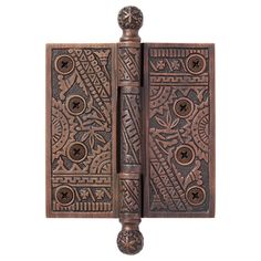 an ornate wooden door with two knobs and decorative designs on the front, side and back