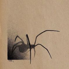 a drawing of a spider on the side of a piece of paper with black ink