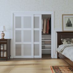 an empty bedroom with a bed, dresser and closet doors open to reveal clothes in the closet