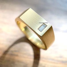 Classic Design Signet Ring, 4X2 MM Baguette Cut Lab Diamond Wide Band Men's Ring, 14k Yellow Gold Satin Finish Ring, Handcrafted Wide Band ✹✹𝐖𝐞𝐥𝐜𝐨𝐦𝐞 𝐭𝐨 𝐂𝐫𝐚𝐳𝐲𝐃𝐢𝐚𝐦𝐨𝐧𝐝𝐬𝐂𝐨✹✹ Detail about stones Moissanite & Simulated Stone: ----------------------------- Stone Shape: Baguette Cut Stone Size: 4X2 mm Weight: 0.14 CT Color: Colorless Cut: Excellent Clarity: VVS Lab-Grown Diamond & Natural Diamond: ----------------------------- Stone Shape: Baguette Cut Stone Size: 4X2 mm Weight: 0.14 CT Color: FG Cut: Excellent Clarity: VS-SI ★ 𝑰𝒕𝒆𝒎 𝑫𝒆𝒕𝒂𝒊𝒍𝒔:- ☛ Metal Purity: Solid Gold (10KT, 14KT, 18KT); Silver(925 Sterling, 935 Argentium), 950 Platinum ☛ Metal Tone: Yellow, White, Rose ☛ Stamp/Hallmark: Yes ★ 𝑪𝒖𝒔𝒕𝒐𝒎𝒊𝒛𝒂𝒕𝒊𝒐𝒏:- ☛ Customized Design Jewelry. ☛ All cuts Luxury Smooth Bezel Men's Ring For Anniversary, Luxury Men's Ring With Smooth Bezel For Anniversary, Luxury Men's Ring With Smooth Bezel, Cheap Gold Men's Ring In Stainless Steel, Luxury Engagement Men's Ring With Smooth Bezel, Luxury Wide Band Men's Promise Ring, Luxury Thick Band Men's Ring In Fine Jewelry Style, Luxury Men's Rings With Smooth Finish, Luxury Men's Classic Ring With Smooth Bezel