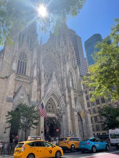 taxis are parked in front of the cathedral