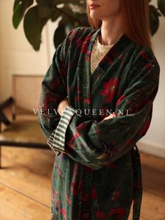 Elevate your wardrobe with our exquisite Velvet Queen Kimono. This luxurious piece features a rich green floral design that exudes elegance and sophistication. Crafted from high-quality velvet, it drapes beautifully, offering both comfort and style. The kimono is versatile enough to wear over casual outfits for a chic daytime look or over evening wear for a touch of opulence. ✔️Design: Long Kimono/Robe with floral bird pattern. Side pocket. Belt same color. The sleeves can be rolled up for added Luxury Green Festive Kimono, Green Bohemian Floral Robe, Green Floral Print Long Robe, Green Silk Kimono With Floral Print, Luxury Silk Kimono With Floral Print, Wedding Robe, Boho Kimono, Long Kimono, Wide Sleeves