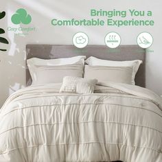 a bed with white comforter and pillows in front of a green sign that says bringing you a comfortable experience