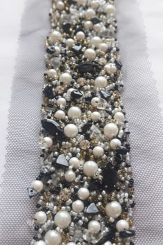 beaded ribbon with pearls and crystals on it