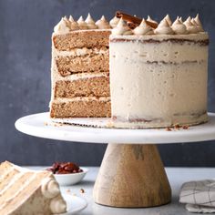 a cake sitting on top of a white plate with a slice taken out of it