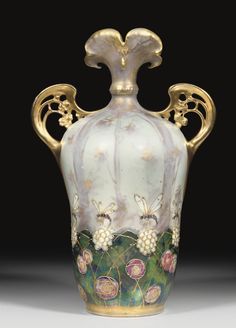 an ornate vase with flowers painted on it