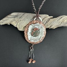 Discover the beauty of nature with this handmade necklace, crafted from textured copper and sterling silver. At its heart lies a unique Lake Superior beach stone set with prongs to showcase its natural beauty. The necklace features an adjustable leather cord, allowing you to wear it at a length that suits your style, from 24 to 30 inches. Adding to its charm are three delicate sterling silver and copper dangles. Perfect for those who appreciate nature-inspired jewelry, this piece brings a touch of rustic elegance to any outfit. Pendant Width 2-3/4" Pendant Height 6" (includes dangles) Lake Superior, Handmade Jewelry Tutorials Necklaces, Stone Beach, Mixed Metal Jewelry, Handmade Jewelry Tutorials, Beach Stones, Nature Inspired Jewelry, Inspired Jewelry, Handmade Necklace