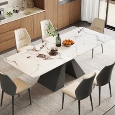 a marble dining table with four chairs around it