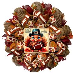 a wreath with an image of a turkey wearing a top hat and holding a football