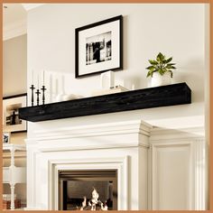 a white fireplace with a black mantle above it