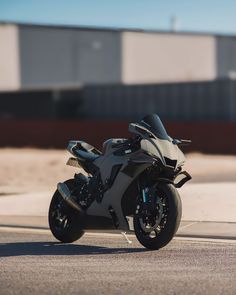 the motorcycle is parked on the side of the road