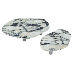 two white and black marble tables with metal legs