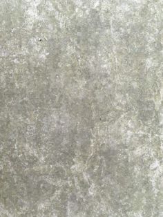 an image of a grungy surface that looks like concrete