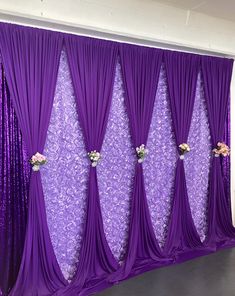 purple wedding backdrop with flowers and sequins