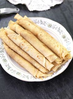 some tortillas are on a white plate