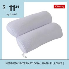 two white pillows sitting next to each other on top of a blue background with the price $