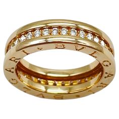 two tone gold wedding band with diamonds on each side and the words love written in cursive writing