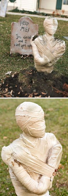 there is a statue in the grass that has been wrapped up and placed next to a gravestone