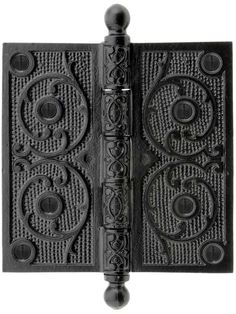 a black door with an ornate design on the front and back panels, which are made out of cast iron