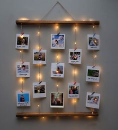 a wall hanging with pictures and lights on it