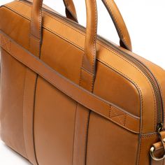 Elevate your professional look with our Shiny Classic Eco-Leather Work Bag, your perfect partner for a seamless transition from boardroom to after-hours. Backed by a lifetime warranty and trade-back options. Modern Cognac Satchel For Office, Cognac Shoulder Bag For Business Trips, Business Shoulder Bag In Cognac With Smooth Grain, Business Cognac Shoulder Bag With Smooth Grain, Modern Cognac Satchel For Work, Leather Shoulder Bag With Smooth Grain For Business, Formal Cognac Briefcase With Top Carry Handle, Classic Laptop Bag With Satchel Shape, Classic Laptop Bag With Smooth Grain For Everyday