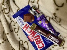 two bars of candy sitting on top of a blanket