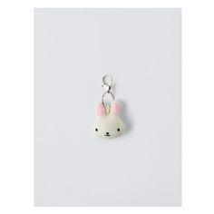 a keychain with a small white bunny face on it's front end