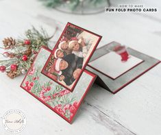 two christmas cards on a table next to pine cones and evergreen branches, with the words fun fold photo cards