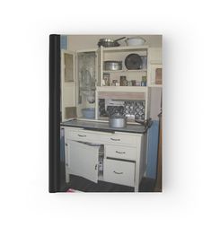 an old fashioned kitchen with pots and pans on the stove top, cupboard doors open