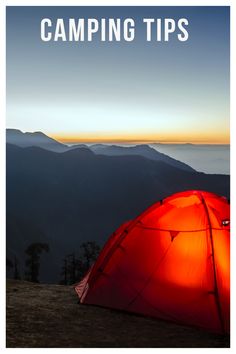 a red tent sitting on top of a mountain under a blue sky with the words camping tips