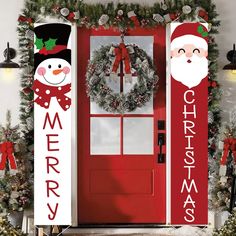 a red door decorated with christmas decorations and wreaths