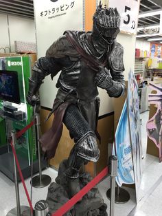 a statue of a knight is on display in a store