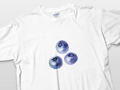 🍇 Hey there, fruit lover! 😋 Check out this adorable Blueberry Trio T-Shirt! 🍇 It's the perfect combo of cute and funny, making it a must-have for your casual wear collection. Whether you're lounging at home or out and about, this tee will make you the berries! 🍇 Plus, it makes a fantastic gift for your foodie friends! 🎁 Get yours now and rock that fruity style! 🍇 Product Features: - Medium-weight cotton fabric 5.3 oz/yd² (180 g/m²) for comfy wear all year round and eco-friendly vibes. - Cl Cute Blueberry, Funny Fruit, Comfy Wear, Foodie Friends, Fruit Design, Look Plus, T Shirt Funny, Fantastic Gifts, Summer Casual