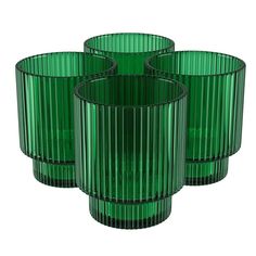 three green glass vases sitting next to each other